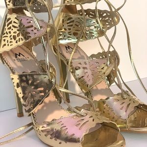Madison gold stiletto lace-up sandals.